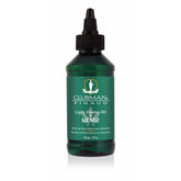 Front view of Clubman Pinaud Light Castor Oil + Hemp 4 oz. bottle, featuring green label with white text and dropper cap.
