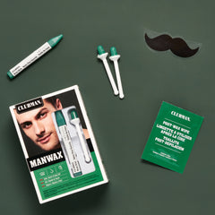 Cluiman ManWax grooming kit with packaging, waxes, and a mustache sticker on a green background