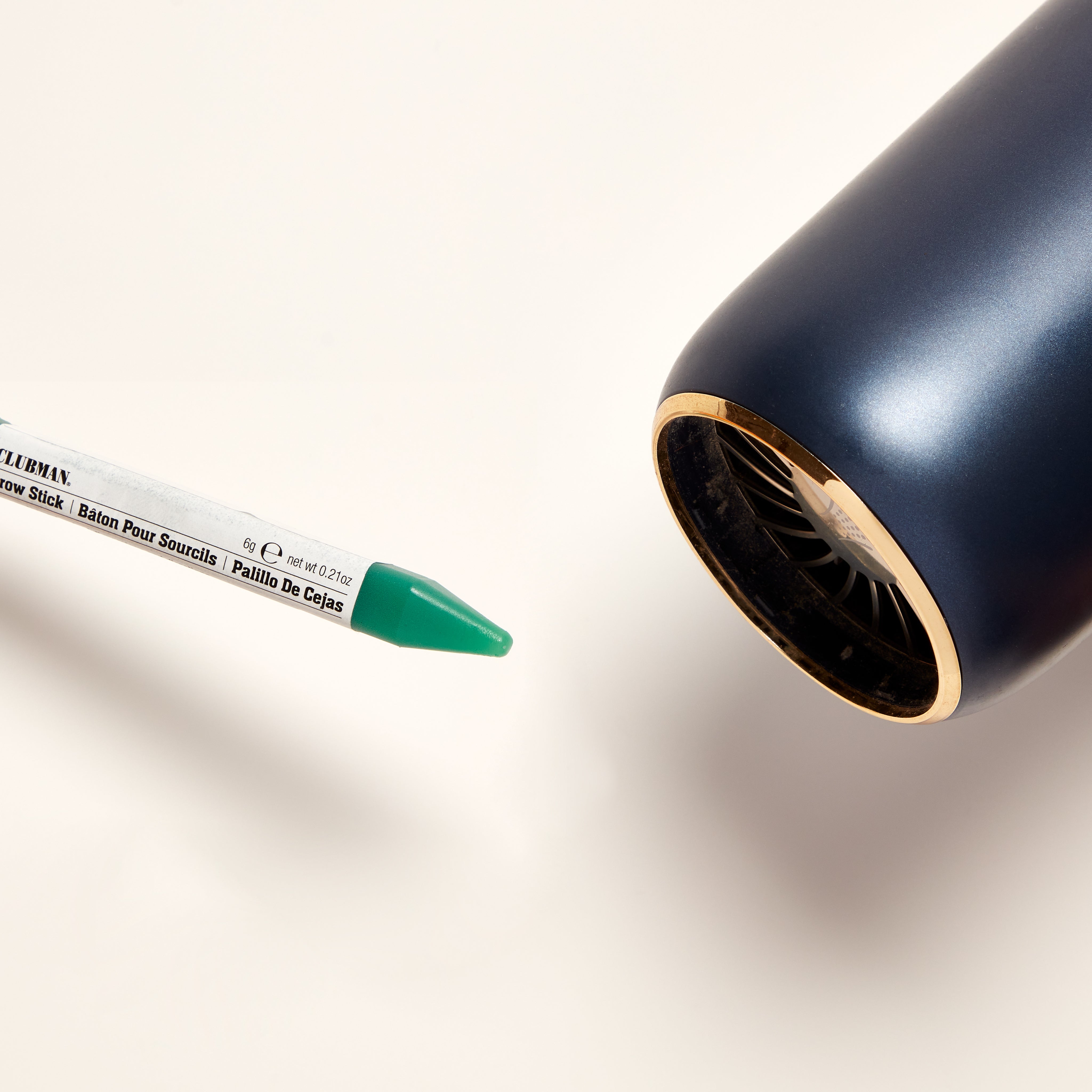 Manwax stick getting melted by hair dryer white background