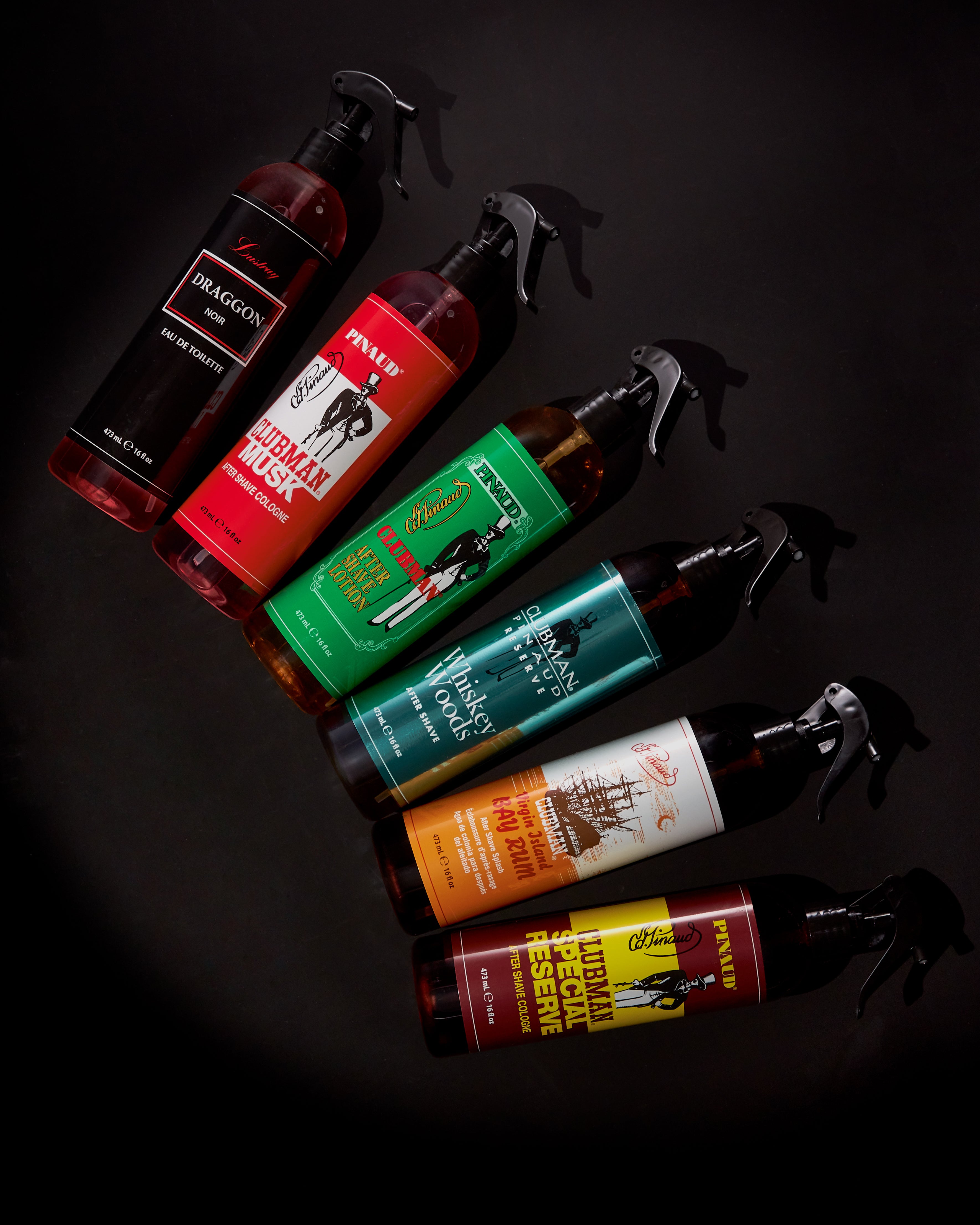 Six Barber Sprays grouped together on a white background stylized. 