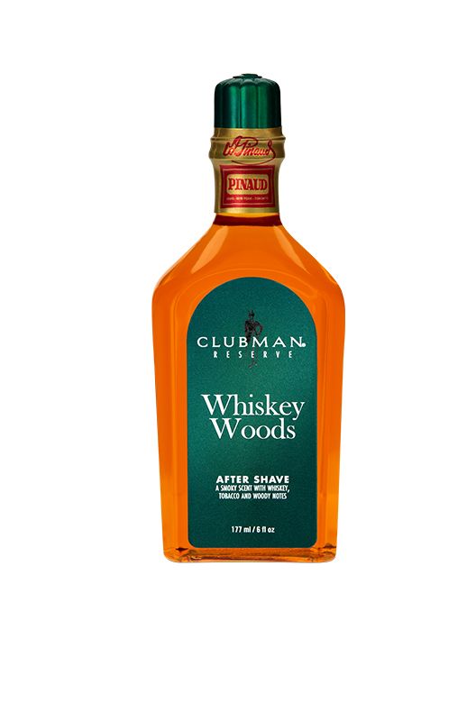 A 6-ounce bottle of Clubman Reserve Whiskey Woods After Shave Lotion featuring its whisky-colored liquid contents