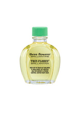Back view of Tres Flores Brilliantine Hair Oil 4 oz. bottle, displaying safety warnings and product details.