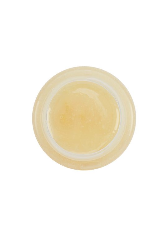 Top-down view of Tres Flores Brilliantine Pomade, highlighting its smooth, glossy texture.