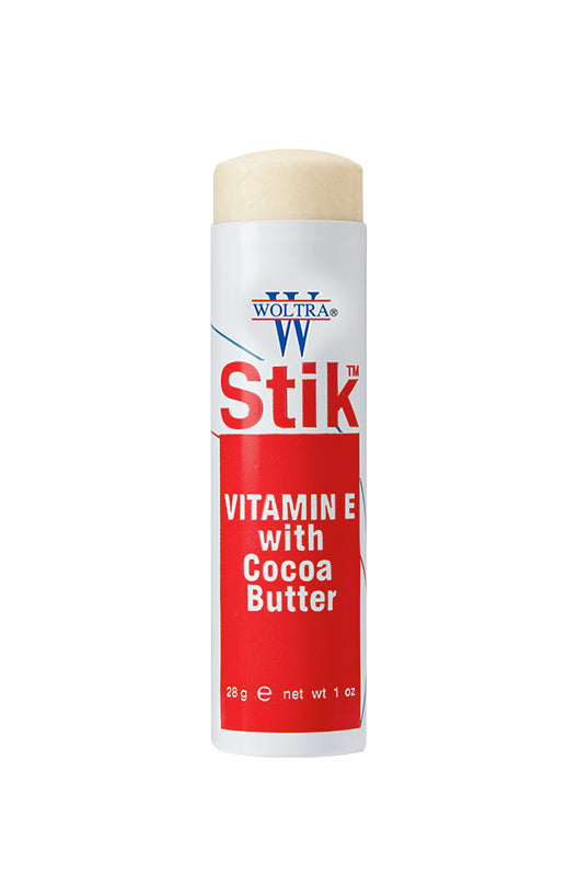 Front view of Woltra Stik Vitamin E with Cocoa Butter 1 oz., featuring red label with white text and product branding.