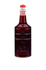 Back of Clubman Pinaud Eau de Quinine Bottle with embossed branding on deep red glass packaging.