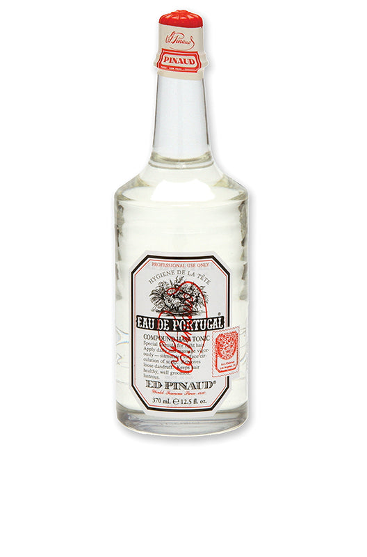 Clubman Pinaud Eau de Portugal Hair Tonic in a clear glass bottle, hydrating and refreshing for hair care.