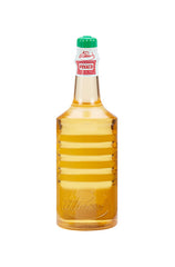 Back of Clubman Pinaud 12.5 ounce bottle with markings & showing its amber colored liquid contents 