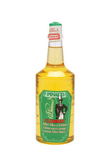 Front view of  a clear 12.5-ounce bottle of Clubman Pinaud After Shave Lotion showing its amber-colored liquid contents