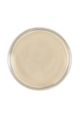 over the top look of an hair molding clay showing its cream color anad texture