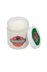 Open 4 ounce tub of Clubman Molding Paste with lid resting on its left side showing its white hair molding paste contents