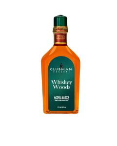 A 6-ounce bottle of Clubman Reserve Whiskey Woods After Shave Lotion featuring its whisky-colored liquid contents